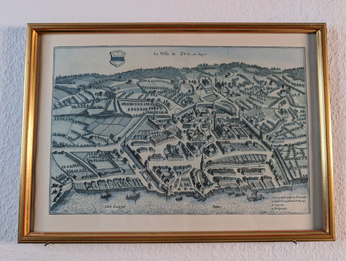 「La Ville de ZUG, en Suisse」ツーク湖畔のツーク旧市街を描いた鳥瞰図です。マテウス・メーリアンの原図に基づく銅版画で、額装済みです。